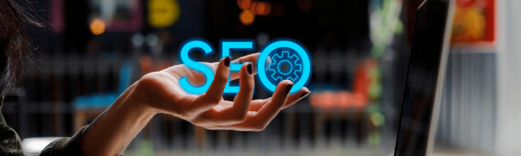 A person holding the word SEO represents leveraging the learnings from mistakes that could be made in 2025.