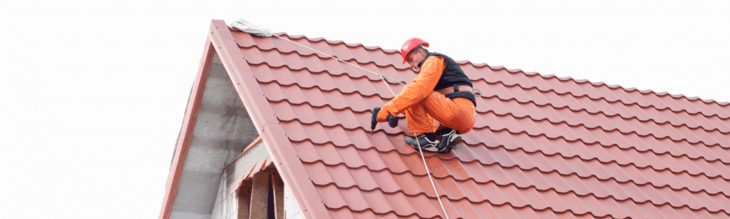 A man wearing orange and red standing on a rooftop, representing the importance of local SEO foot traffic for roofing companies.
